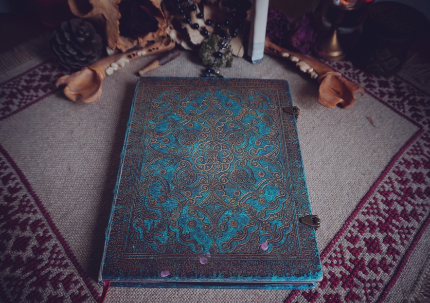 Magickal diary on Romanian carpet with pattern 