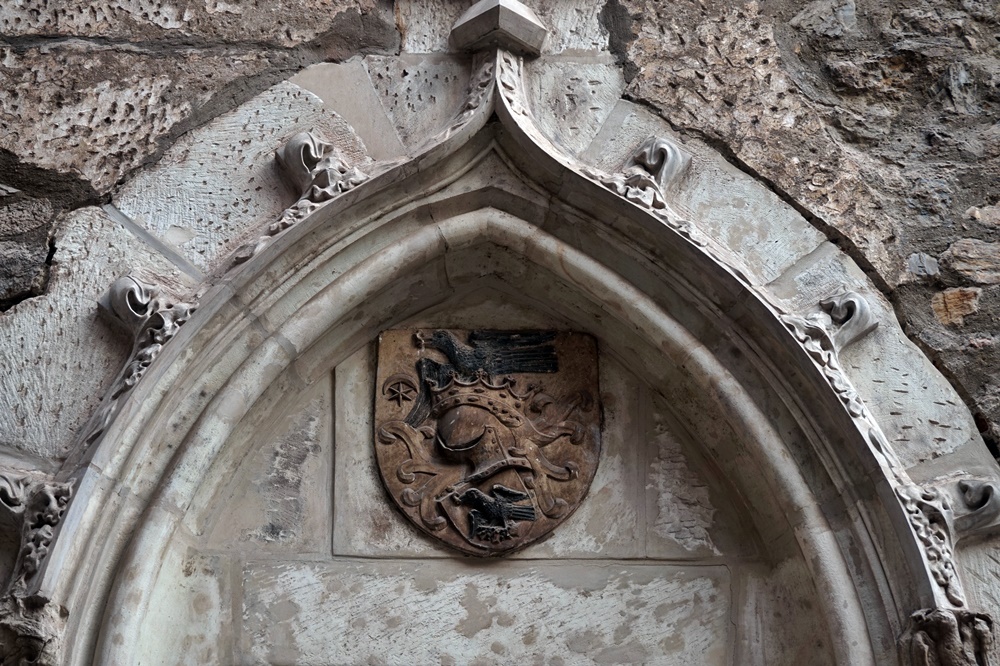 Coat of Arms of the Hunyadi Family showing Raven. Corvin Castle. Photo by Radiana Pit. 