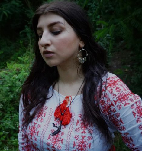Radiana Pit in her Ia, the traditional romanian blouse with ethnic patterns and typically red on white